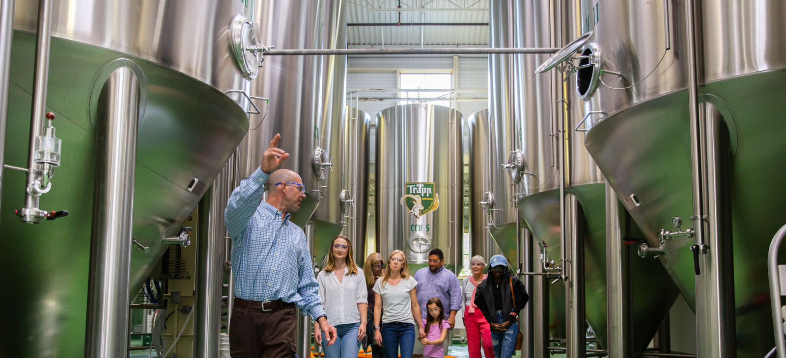 man giving tour of brewery