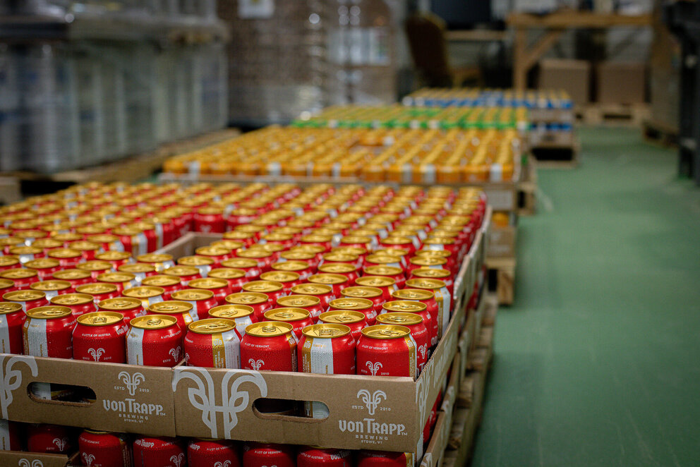 flats of beer cans in warehouse