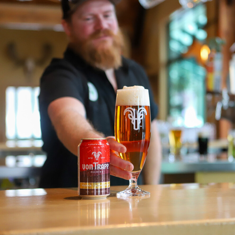 bartender serving glass of vienna