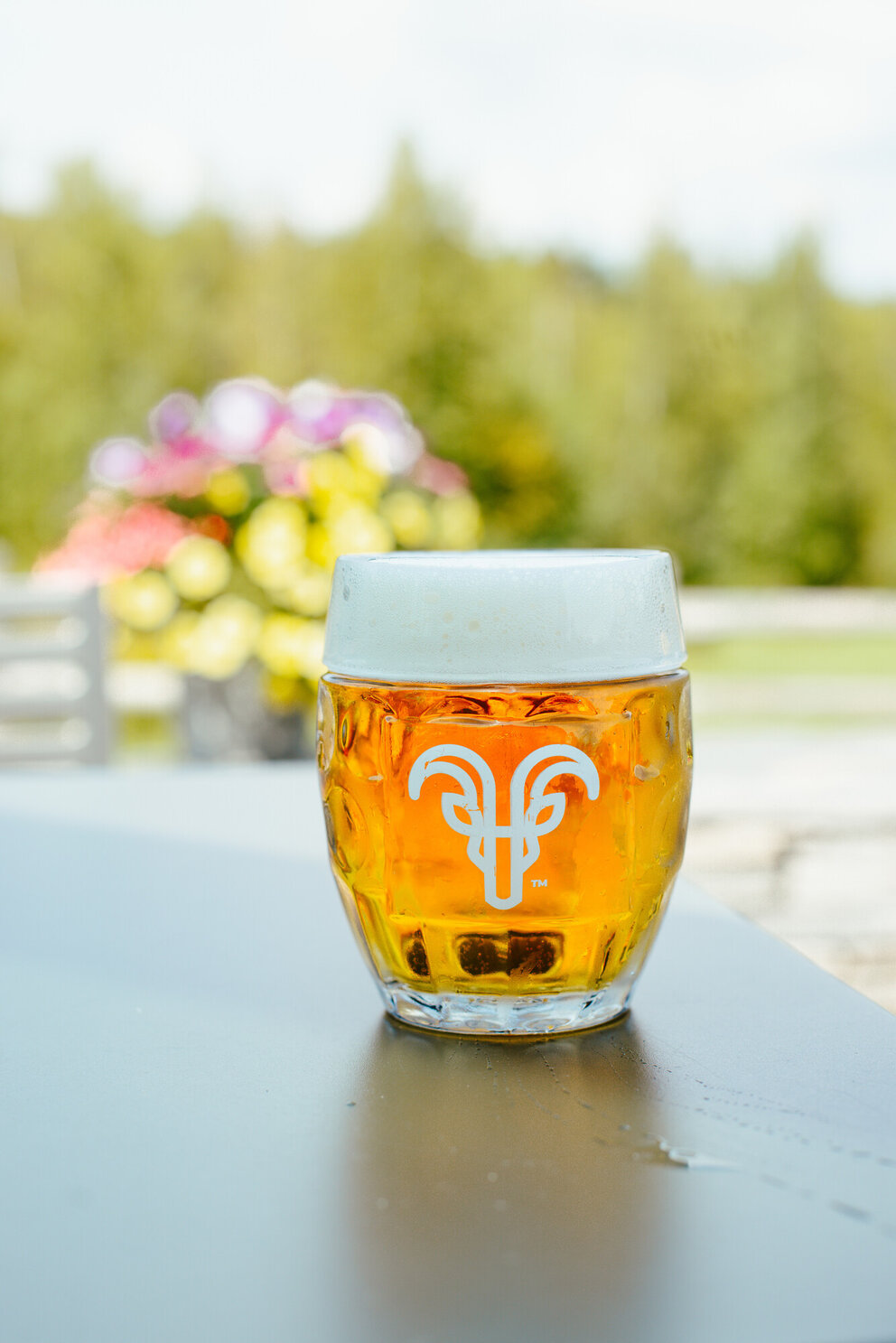 a glass of beer on a table