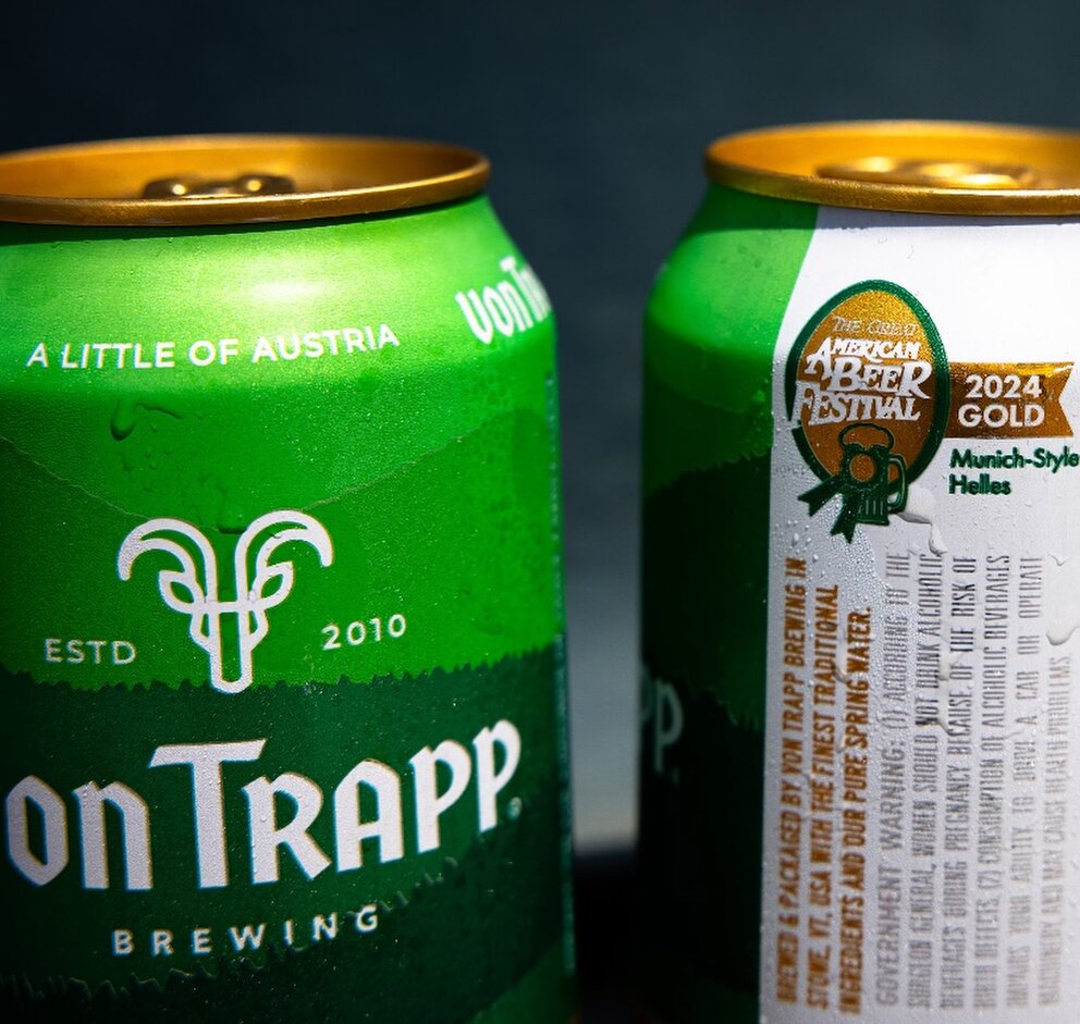 two green cans with white text