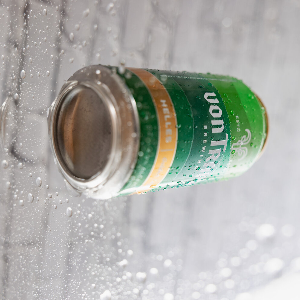 a can of beer on a window